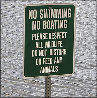 Sign posted at the lake