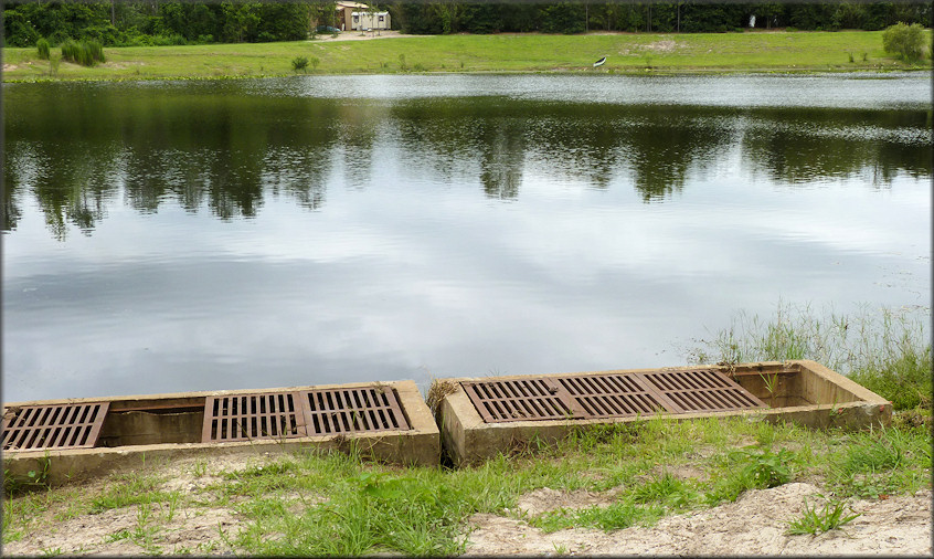 Lake and overflow spillway at the lake on Old St. Augustine Road